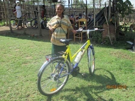 A girl from Siraro District, Ethiopia proudly displays her new 'Dream Bike'