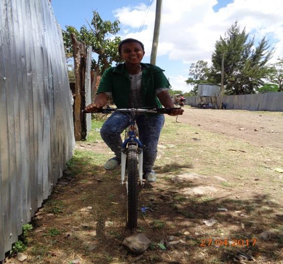 Rahel riding her bicycle to school